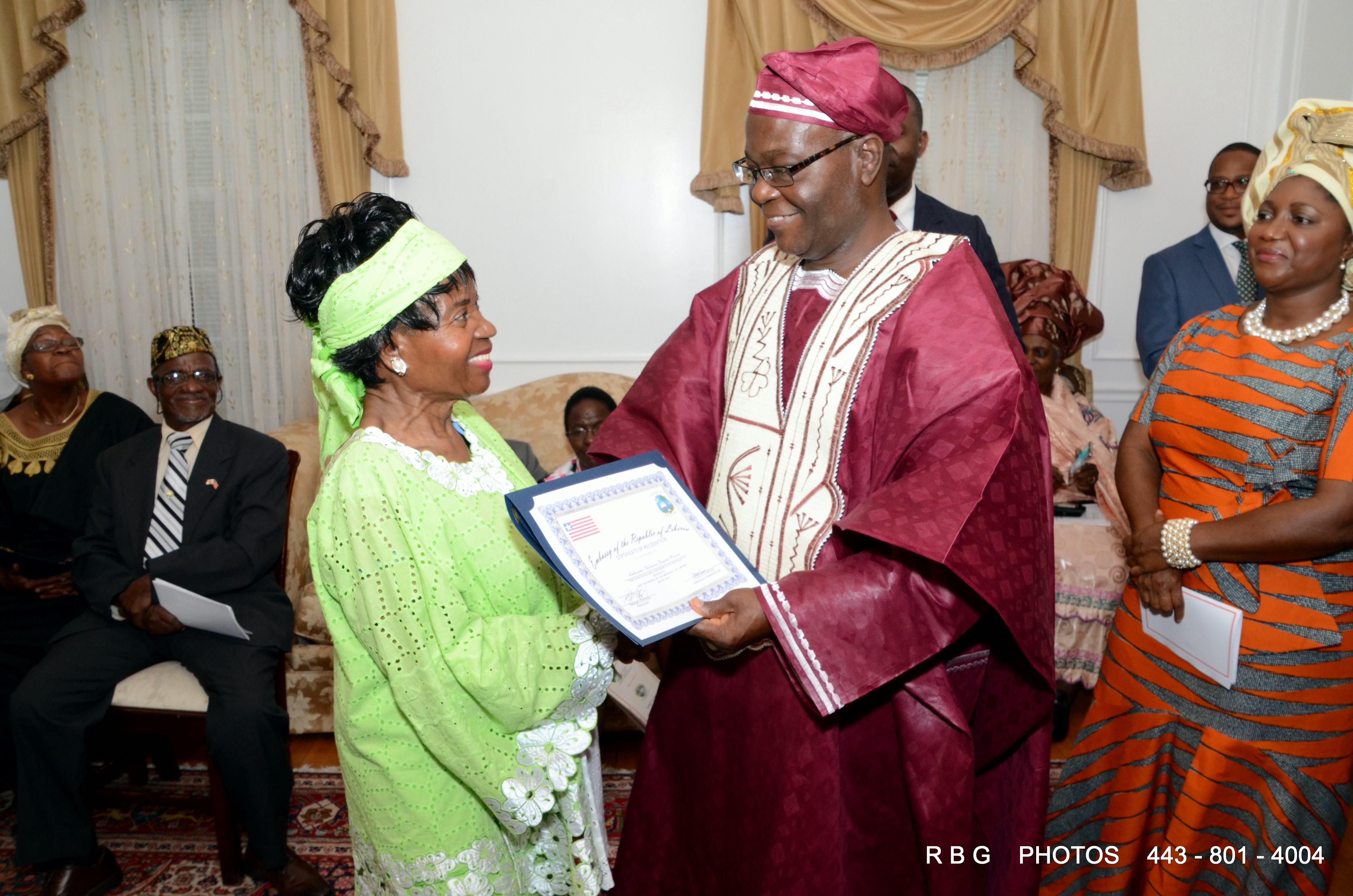 Amb. Jeremiah Sulunteh presents certificate of appreciation to Amb. Philomena Bropleh-Mensah
