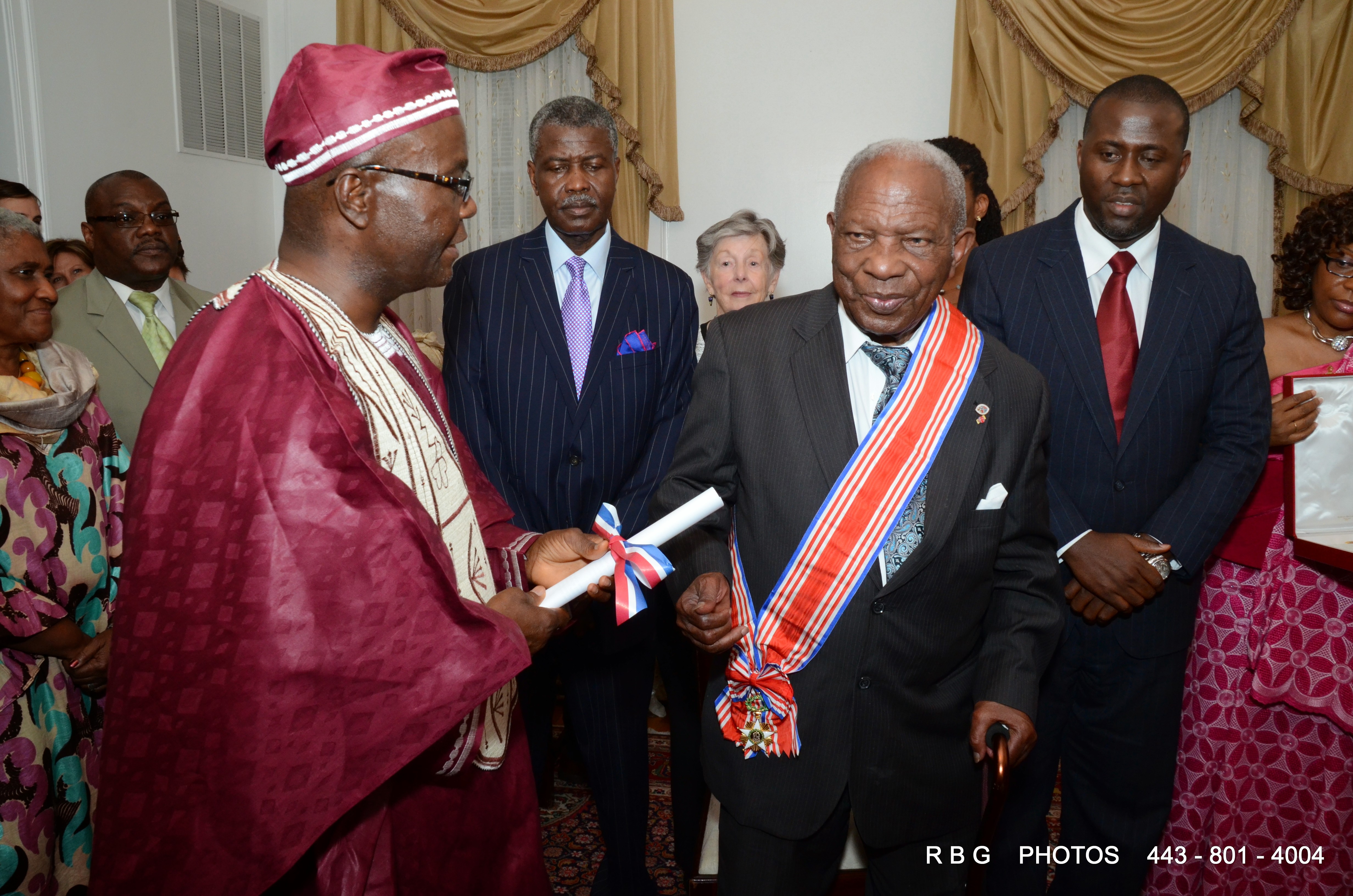 Amb. Jeremiah Sulunteh presents the Presidential Citation to Rev. Dr. Emmanuel Johnson