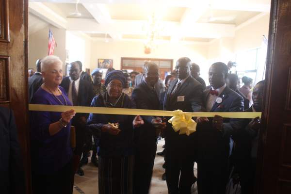 President Sirleaf and others cut the ribbon to the trade fair in the ballroom of the Monrovia City Hall